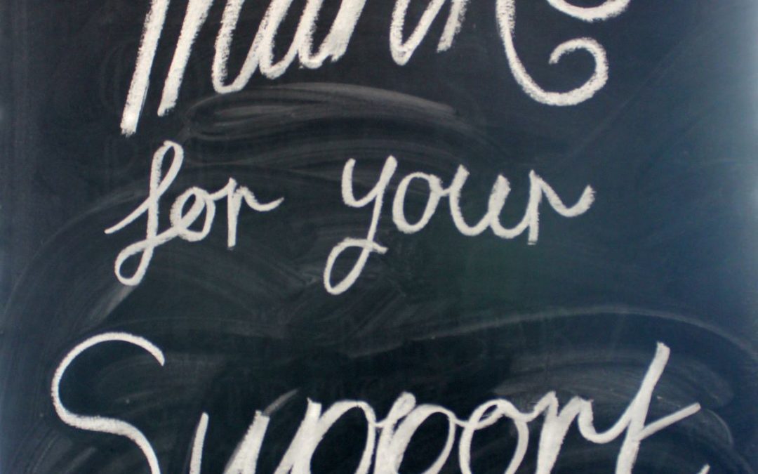 "Thanks for your support" words written on blackboard